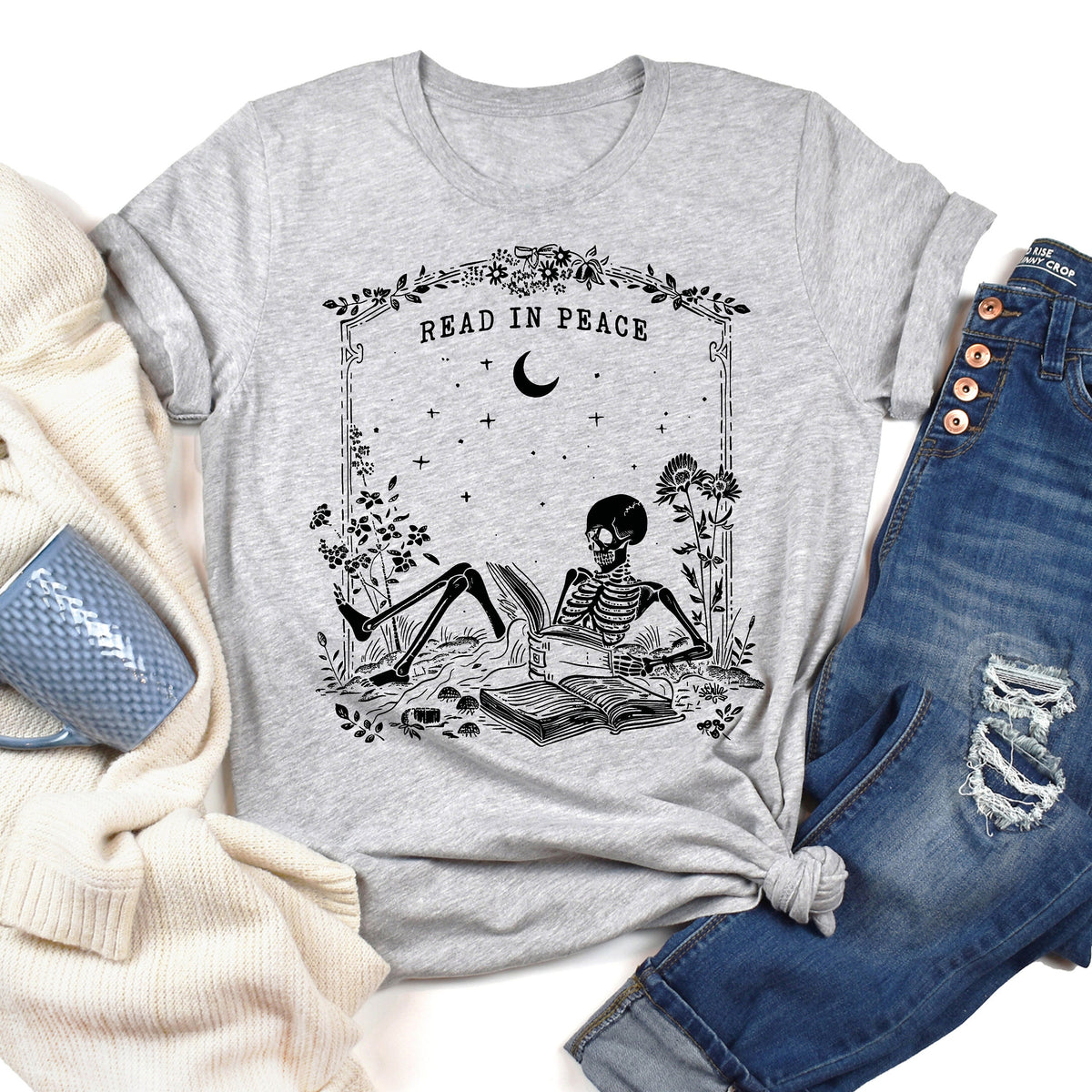 Read in Peace Shirt, Skeleton Halloween T-Shirt, Book Lover Skeleton Tee, Halloween Bookish Gift, Skeleton Reading Shirt, Spooky Season Gift